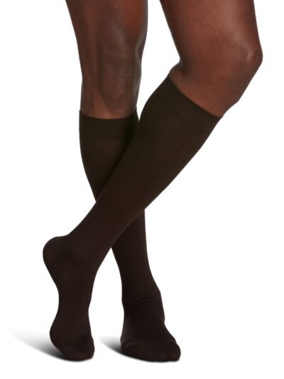 Man wearing Sea Island Cotton compression socks with crossed legs in Brown color